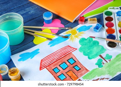 Child's Painting Of House On Table