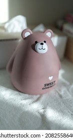 Child's pink piggy bank inculcating the habit of saving among children - Shutterstock ID 2082558640