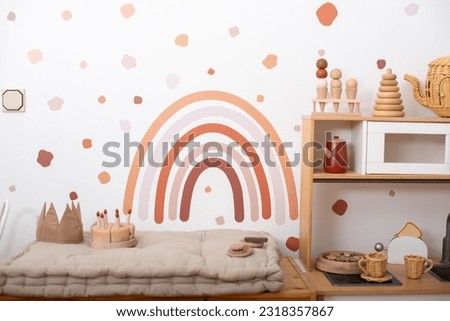 Child's room interior with rainbow painting on wall. rainbow in Scandinavian children's room