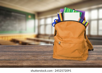 Child's school backpack on table in classroom - Powered by Shutterstock