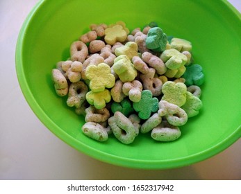 Child's Shamrock St. Patrick's Day Marshmallow and Oat Cereal in a Green Bowl on a High Chair Tray