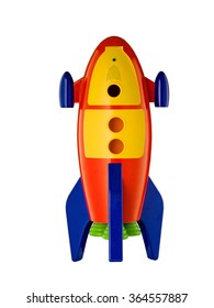 Childs Toy Rocket On White Background With Reflection