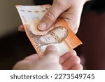 Chile 20 thousand pesos, banknote, Passing money from hand to hand, Financial and business concept, Chile