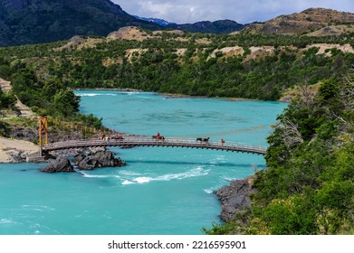 Chile, Aysen. Horsepackers on a bridge crossing the Baker River. - Shutterstock ID 2216595901