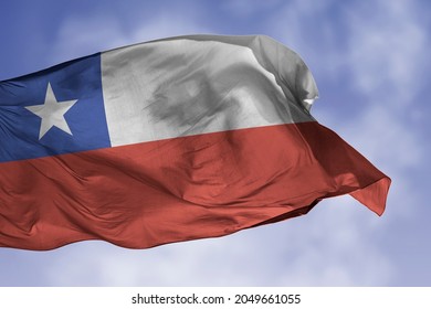 Chile flag isolated on the blue sky with clipping path. close up waving flag of Chile. flag symbols of Chilean.