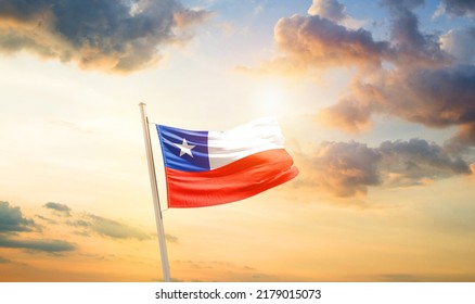 Chile national flag waving in beautiful clouds.