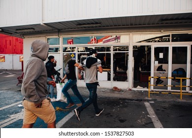 QUILPUÉ, CHILE - OCTOBER 20, 2019 - Protesters loot Supermarket during protests of the "Evade" movement against the government of Sebastian Piñera