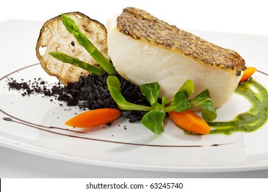 Chile Sea Bass (black sea bass) served with Black Risotto, Herbs and Vegetables