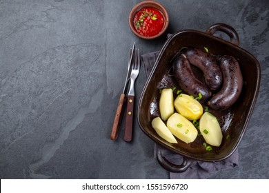 Chilean bloody sausages PRIETA with potatoes and sauce, Top View
