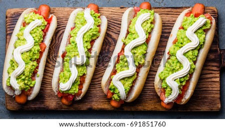 Chilean Completo Italiano. Hot dog sandwich with tomato, avocado and mayonnaise. Top view, copy space