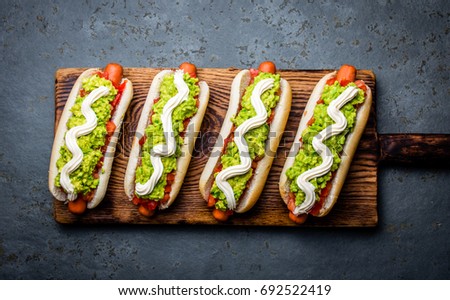 Chilean Completo Italiano. Hot dog sandwich with tomato, avocado and mayonnaise. Top view, copy space