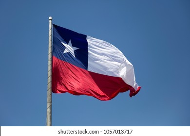 Chilean flag waving under blue sky