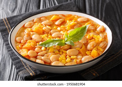 Chilean Porotos granados bean stew with vegetables close-up in a bowl on the table. horizontal