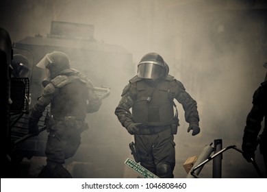 Chilean Riot Police Amid Tear Gas Clears Barricades