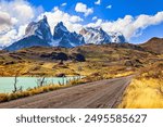 Chilean Torres del Paine National Park. Magnificent snow-capped black cliffs of Los Cuernos.   Patagonia. The azure-colored water of Lake Pehoe from melting glaciers.