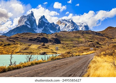 Chilean Torres del Paine National Park. Magnificent snow-capped black cliffs of Los Cuernos.   Patagonia. The azure-colored water of Lake Pehoe from melting glaciers. - Powered by Shutterstock