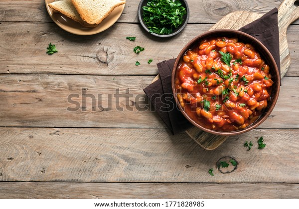 Chili\
Beans on wooden table, top view, copy space. Homemade stewed vegan\
vegetarian recipe with kidney beans and\
vegetables.