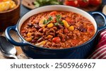 Chili Con Carne: Hearty stew with ground beef, beans, tomatoes, and spices. Simmered to perfection for a flavorful, comforting dish.