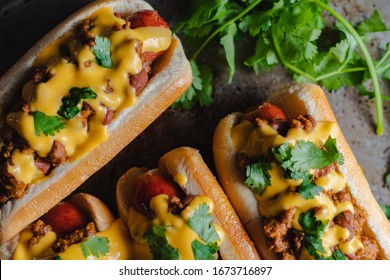 Chili Hotdogs With Melted Cheddar Chease And Cilantro 