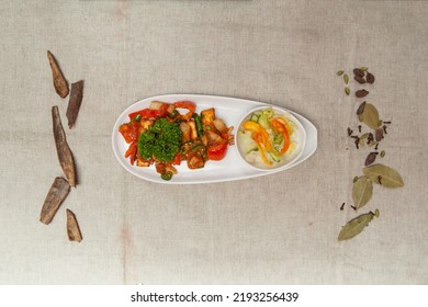 Chili Paneer With Salad Served In A Dish Isolated On Table Top View Of Indian Spices Food