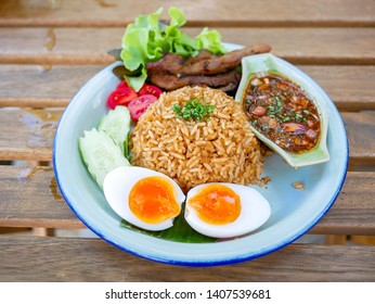 chili paste fried rice with grill pork with Fish sauce with chili. Fish sauce with red chili and Boiled egg