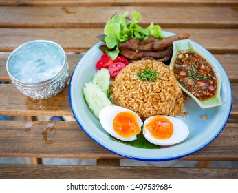 chili paste fried rice with grill pork with Fish sauce with chili. Fish sauce with red chili and Boiled egg