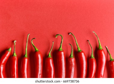 Chili Pepper On Red Background, Top View