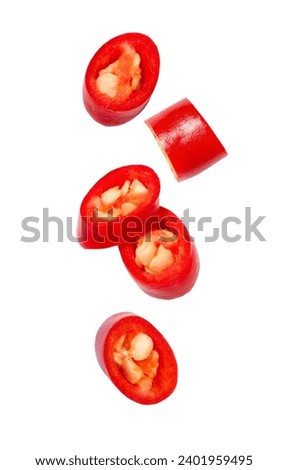 Chili pepper sliced flying in the air isolated on white background.
