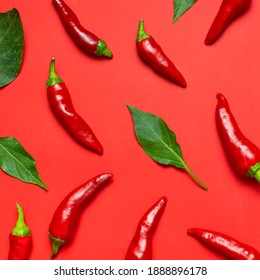 Chili peppers background. Hot red and green fresh chili peppers on red background flat lay top view. Seasoning for dish, spicy spices for cooking, cayenne pepper, food. Creative layout, chili pattern - Shutterstock ID 1888896178