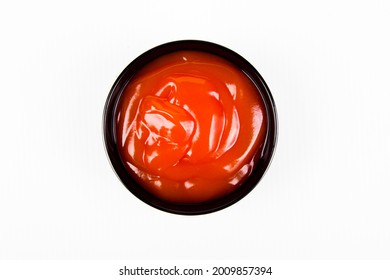 Chili Sauce In Black Ceramic Cup Isolated On White Background.