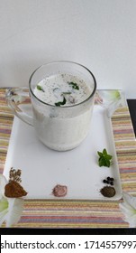 Chilled Masala Buttermilk Served In A Mug. Made With Buttermilk, Black Salt, Black Pepper, Roasted Cumin Seed Powder, Ice And Fresh Mint Leaves.