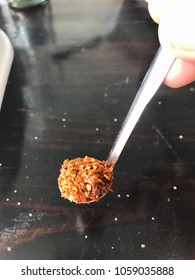 Chilli in mini stainless spoon