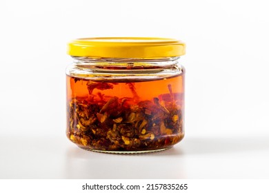 Chilli Oil In A Jar On White Background