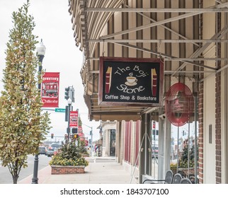 Chillicothe, MO / United States of America  - October 28th, 2020 : Small hanging sign for The Boji Stone in downtown Chillicothe, a coffee house restaurant and bookstore.
