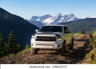 Chilliwack, British Columbia, Canada - July 25, 2020: Toyota Tacoma riding on the 4x4 Offroad Trails in the mountains during a sunny summer morning.