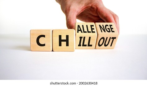 Chillout or challenge symbol. Businessman turns the wooden cube and changes the word chillout to challenge. Beautiful white background. Business and chillout or challenge concept. Copy space.