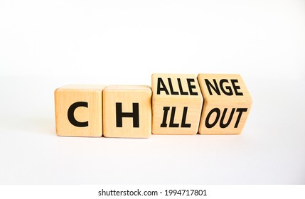 Chillout or challenge symbol. Turned the wooden cube and changed the word chillout to challenge. Beautiful white background. Business and chillout or challenge concept. Copy space.
