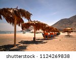 Chimbote, Peru - April 11, 2018: Beach at Vesique in north Peru with beach furniture