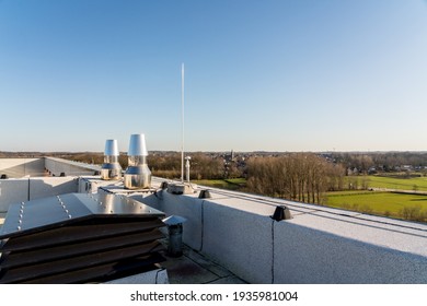 Chimney On The Flat Roof Off A Big Building In The City