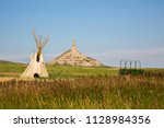 chimney rock national historic site.  It  is a prominent geological rock formation in western Nebraska, rising nearly 300 feet above the surrounding North Platte River valley