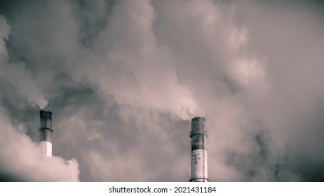 Chimneys Of A Thermal Station With Steam And Smoke, Monochrome Photo - Environmental Impact And Global Warming Concept