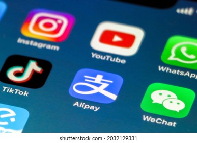 China - August 22nd 2021: 3  Chinese Social Media Apps, WeChat, Alipay and Tik Tok in focus, as 3 Western Social Media Apps, Instagram, YouTube and WhatsApp are out of focus