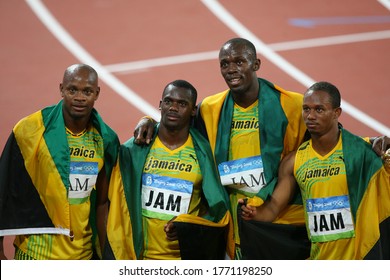 
China Beijing August 2008 Summer Olympic Games: (LR) Asafa Powell, Nesta Carter, Usain Bolt And Michael Frater Won The Gold Medal As Champion In The Men's 4 X 100m Flag Race.