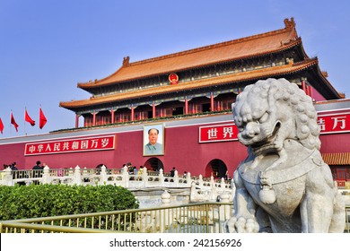 CHina Beijing Tiananmen gate entrance to Forbidden city with stone monument lion. Chinese placards: "Long Live the People's Republic of China",  "Long Live the Great Unity of the World's Peoples".