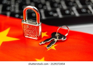 China cyber security concept. Padlock on computer keyboard and China flag. Close-up view