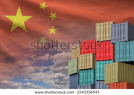 China flag and big stack of shipping cargo containers in docks with sky background close up