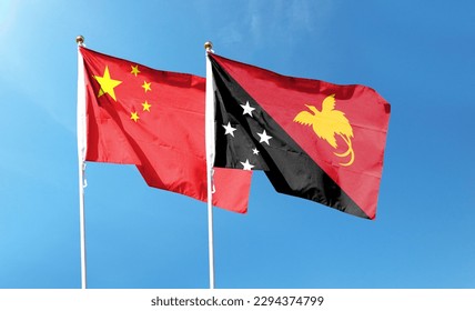 China flag and Papua New Guinea flag on cloudy sky. waving in the sky