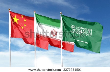China flag with saudi arabia flag and iran flag on cloudy sky. waving in the sky