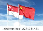 China flag and Singapore flag on cloudy sky. waving in the sky