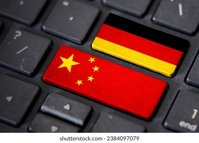 China and Germany flags on computer keyboard. Relationship between two countries.